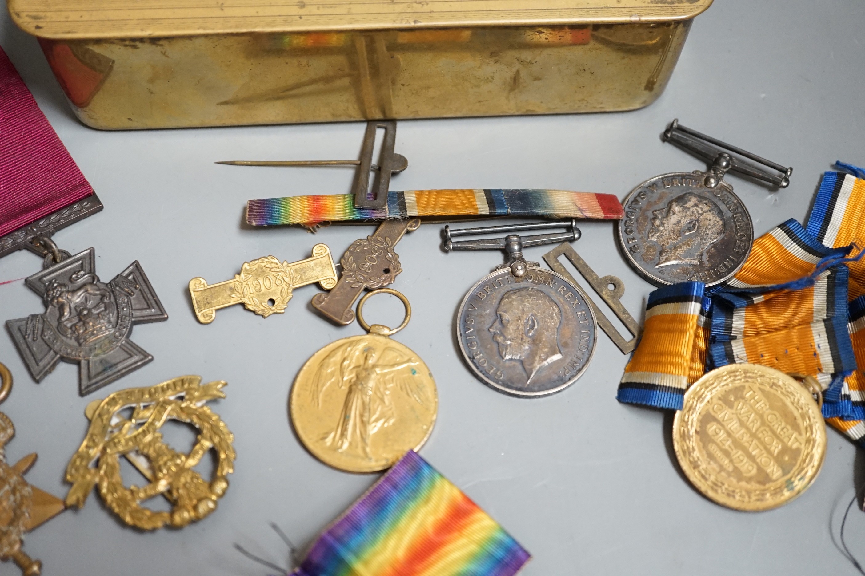 A WWI medal trio awarded to 4483 PTE. F. E. SHARP. 24 - LOND. R., an allied victory medal and matching British war medal awarded to 57292 GNR. D. KENDALL. R. A. with an honourable discharge certificate given to 5723 J. O